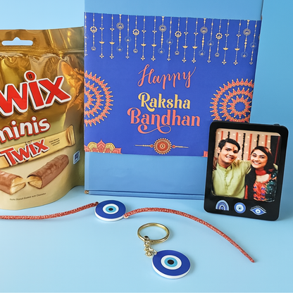 Stylish Rakhi Gift Sets for Brother – Evil Eye Rakhi, Photo Magnet, Keychain & Chocolate in Festive Box