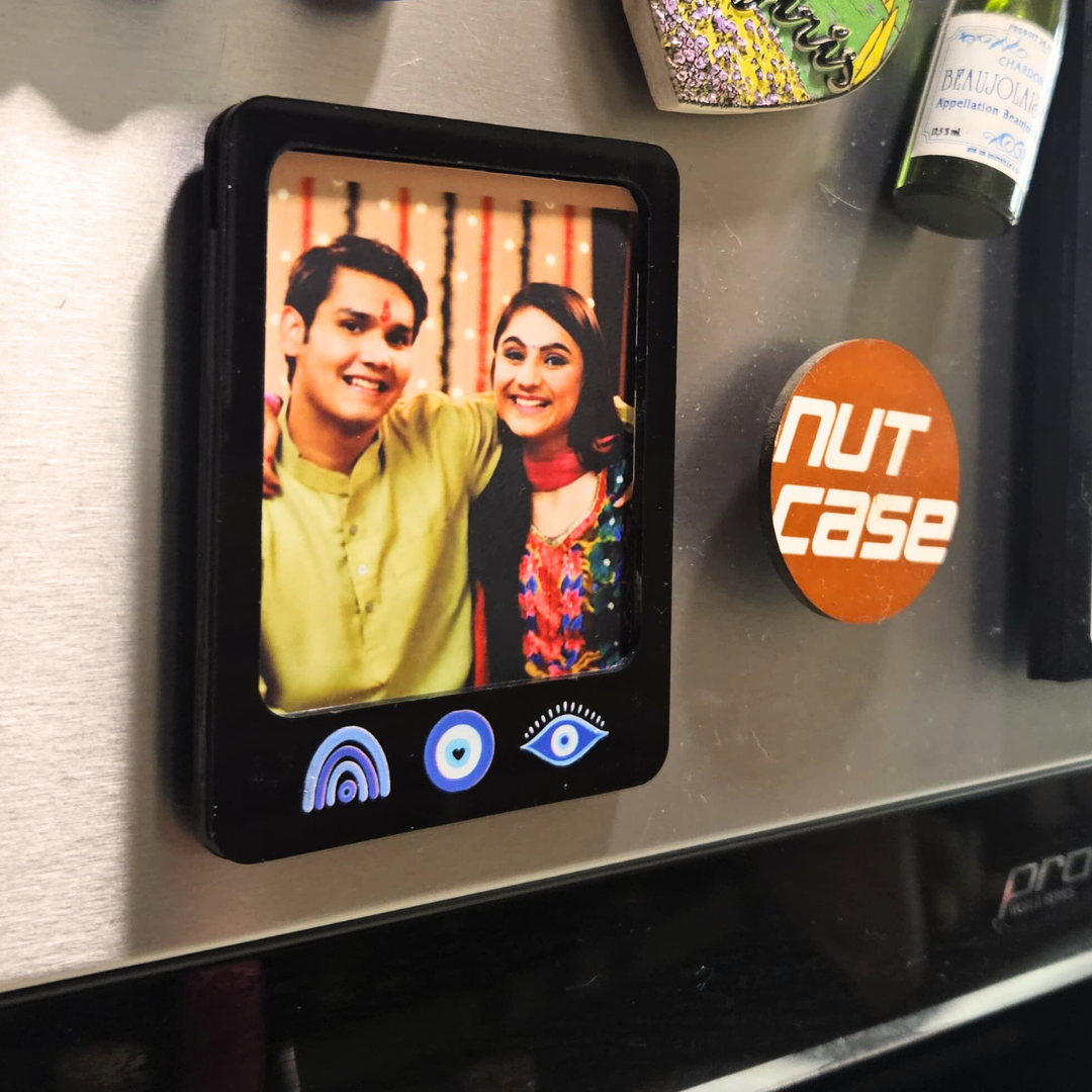 Stylish Rakhi Gift Sets for Brother – Evil Eye Rakhi, Photo Magnet, Keychain & Chocolate in Festive Box